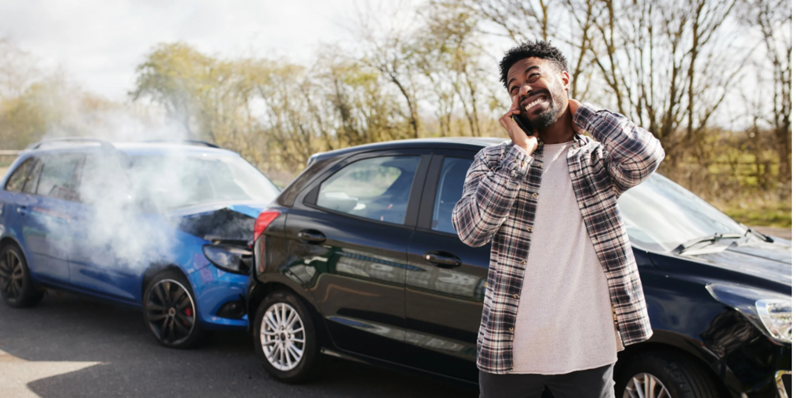 Driver calling for help after suffering a rear end collision involving two vehicles.